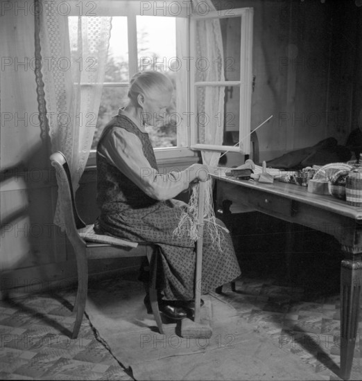 Woman braiding straw, 1940.