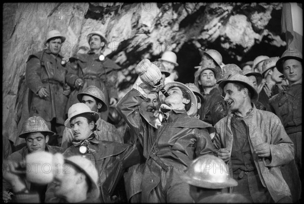 Cheering among the miners at breakthrough, Grand-St-Bernard 1962.