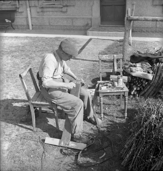 Illens FR: farmer doing carpentry; 1952.