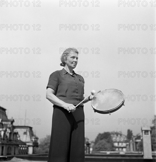 Gymnastics teacher with tambourin; gymnastics school 1940.