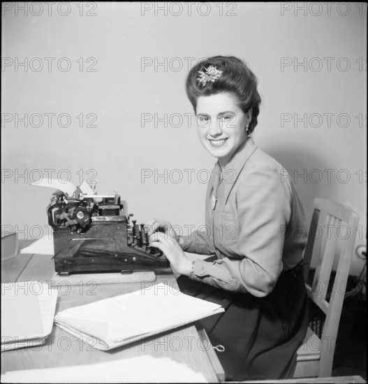 Woman works in Office 1946.