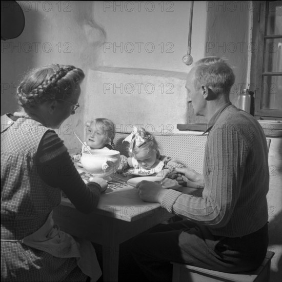 Family eating in Sils-Albula, 1952.