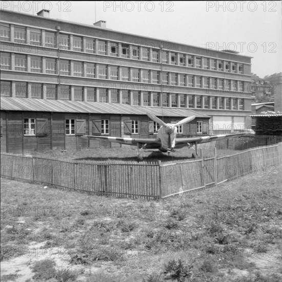 Old fighter aircraft as gift for trade school Lausanne 1959.
