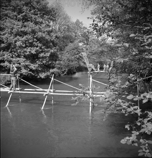 Sappers building bridges across arm of Aare, Brugg 1950.
