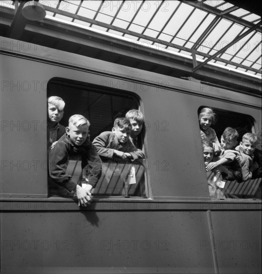 Children looking out of the train window.
