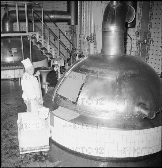 Soup is being cooked in mashing tub, brewery; 1945.