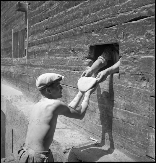 Men baking bread in St. Luc, Valais, in 1941.