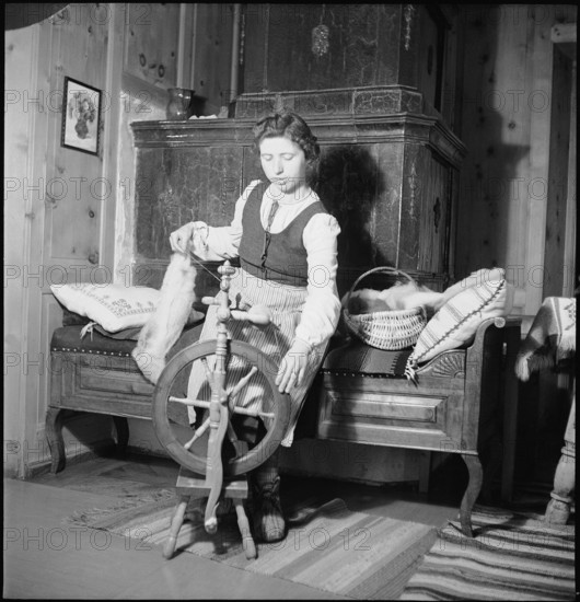 Woman spinning in weaving mill in the Munstertal, 1946.