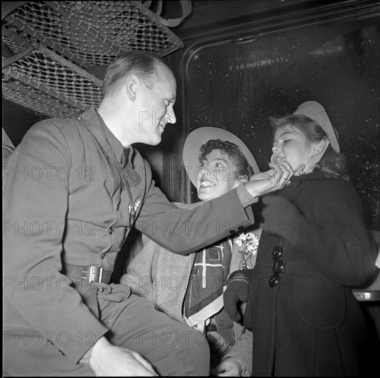 Homecoming Dr. Bucher from Basle is welcomed by his family.