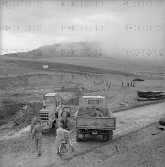 Workers preparing the ground for a drilling derrick; 1958.