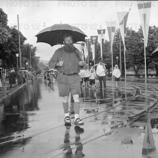 SAFFA fair 1958: man dressed as William Tell at procession on Switzerland founding canton's day.