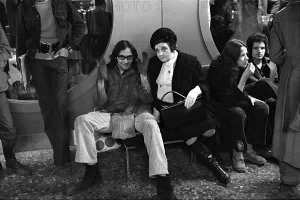 Woman with homeless teenagers in Zurich's shopville, 1971.