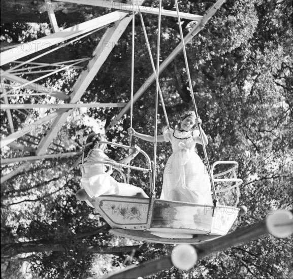 Girls on a fair swing, Lausanne 1942.