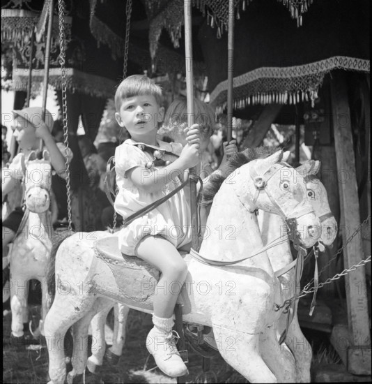 Boy on a merry-go-round, Lausanne 1942.