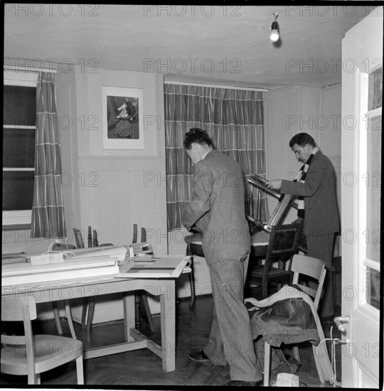 Zurich students furnishing house for colleagues from Hungary 1956.