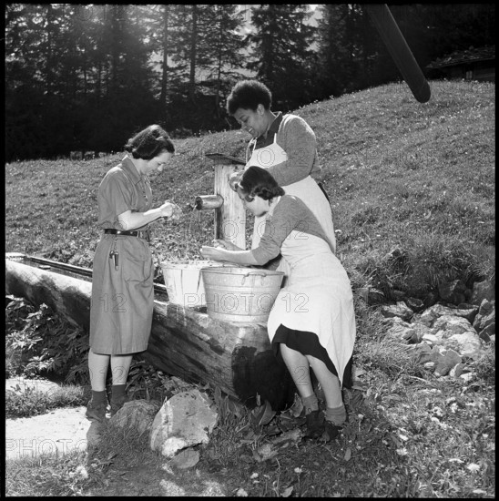 Girl scouts washing vegetables at the fountain, 1952.