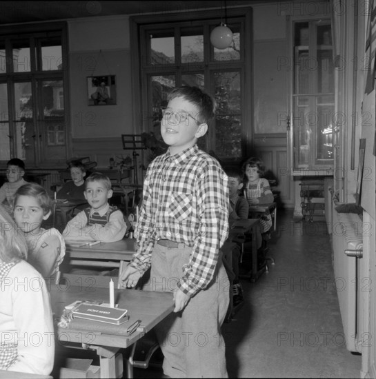 School boy with christmas present for children in Hungary, Zurich 1956.