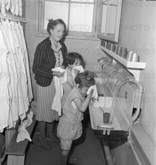 Girls having a wash, children's home Lausanne 1942.