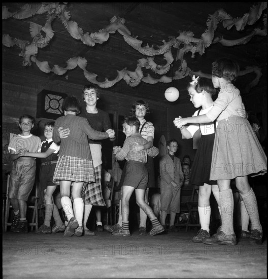 La Forclaz; people celebrating the national holiday, children dancing; 1953.