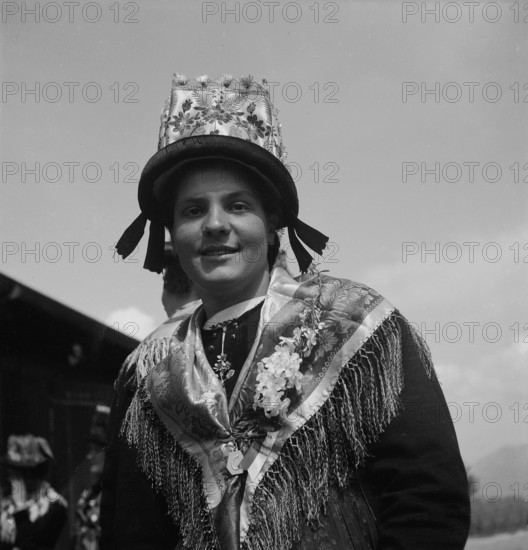 Woman in traditional costume of the Valais, 1946.