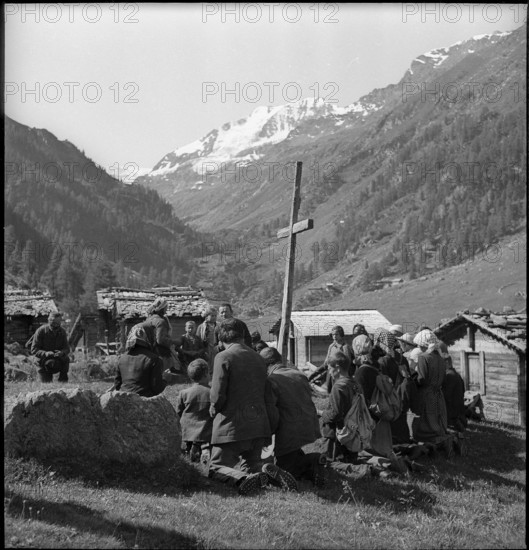 Farmers praying in the Turtmanntal valley, Switzerland, 1940.