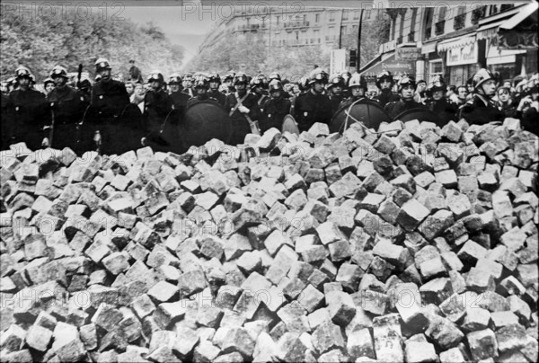 Student riots in Paris 1968: Policemen and paving stones.