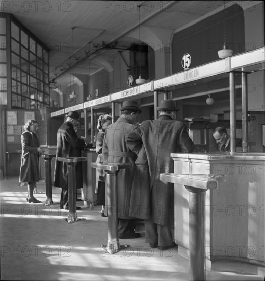 Clients at post office counter;  1943.
