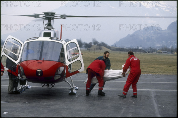 Rescue helicopter in action in the alps of Glarus 1992.