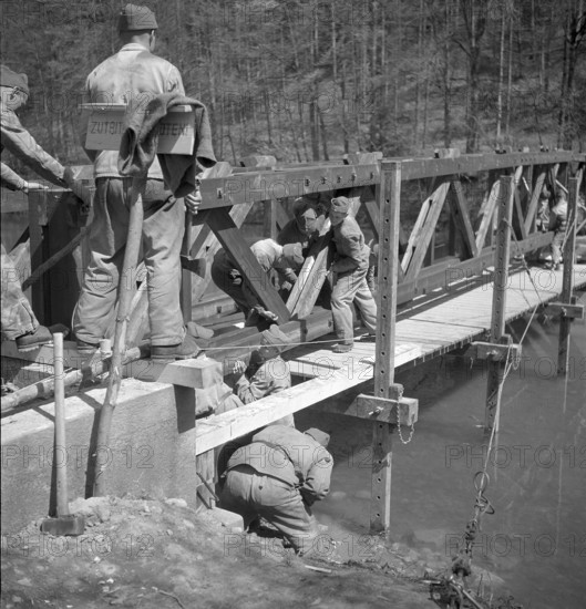 Soldiers constructing footbridge over the Sihl; 1950.