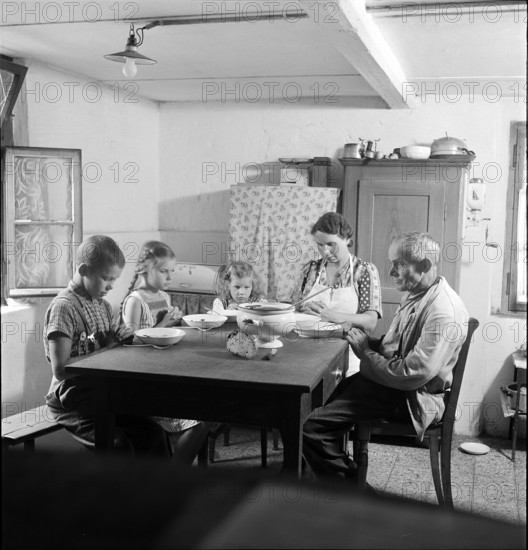 Family Praying before Meal at Table, 1945.