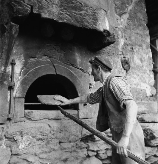 Baking bread in a Valais village, 1941.