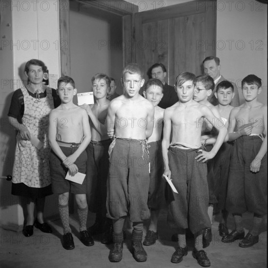 Boys and adults at X-ray initiative , Neuchatel 1943.