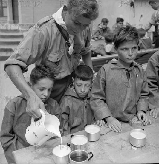 Together at the table with bread and drink.
