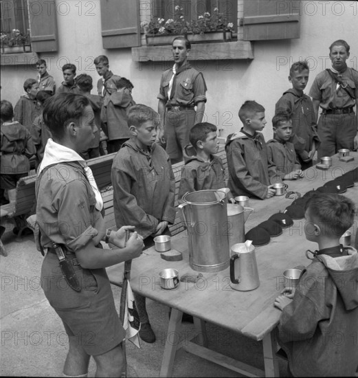 Together at the table with bread and drink.