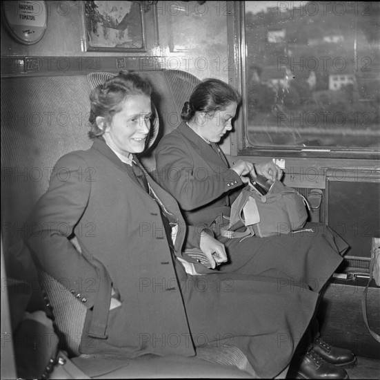 Arrival at the railway station, in the train compartment.