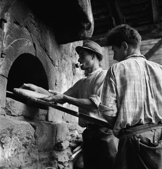 Baking bread in a Valais village, 1941.