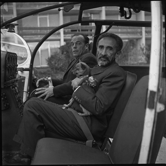 Emperor Haile Selassie with little dog in the Valais, 1965.