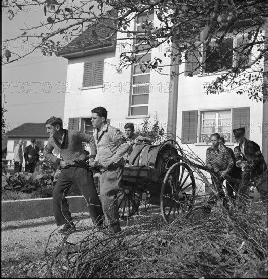 War fire brigade; men pulling hose cart; 1939.