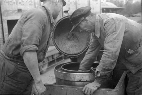 Workers learning how to use cars powered by wood gas 1941.