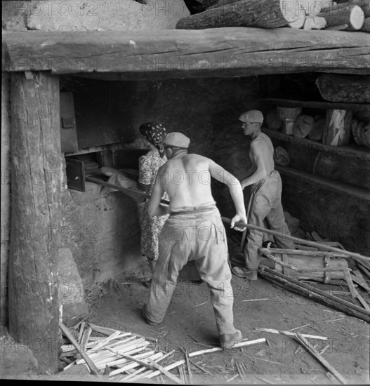 Men baking bread in St. Luc, Valais, in 1941.