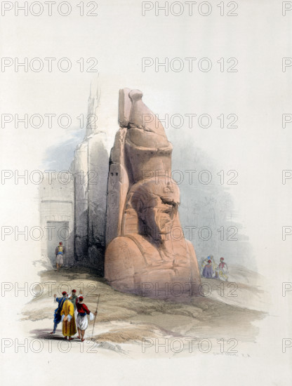 One of two colossal statues of Ramses II. Entrance to the temple in Luxor
