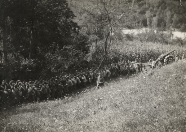 Soldiers towing artillery