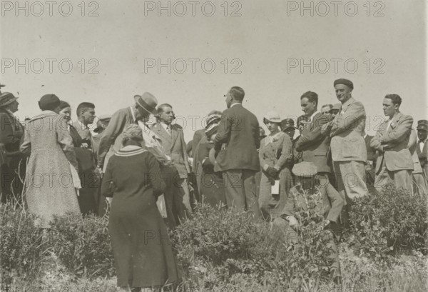 Listening to the guide. 
	
		1924