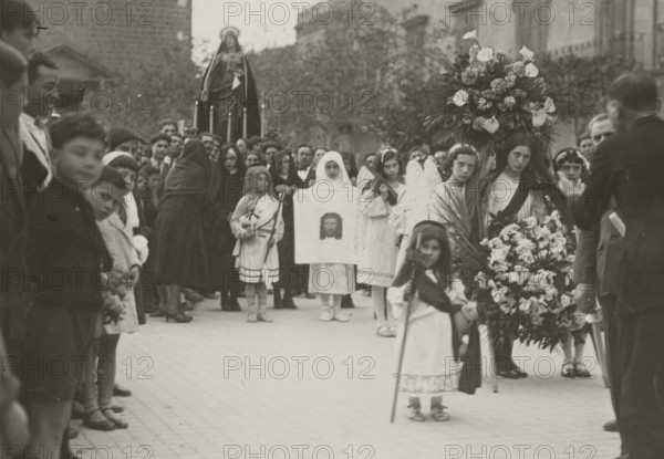 A procession. 
	
		1924