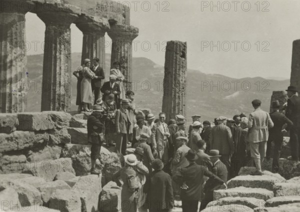 Members of the Touring Club Italiano  in the Temple of Juno in Agrigento. 
	
		1924