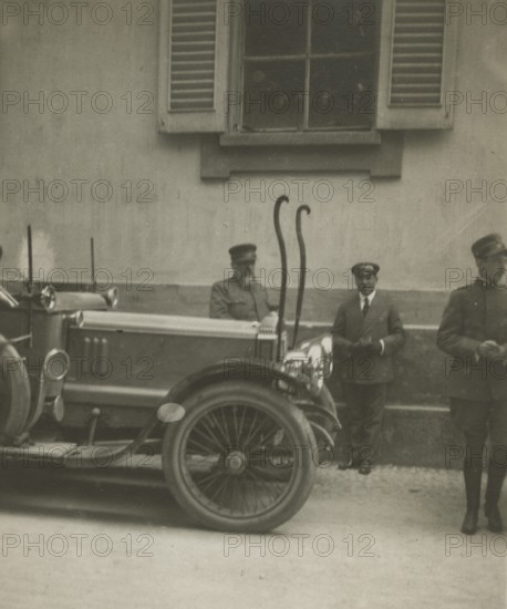 Frederick Johnson next to a car. 1915-1925