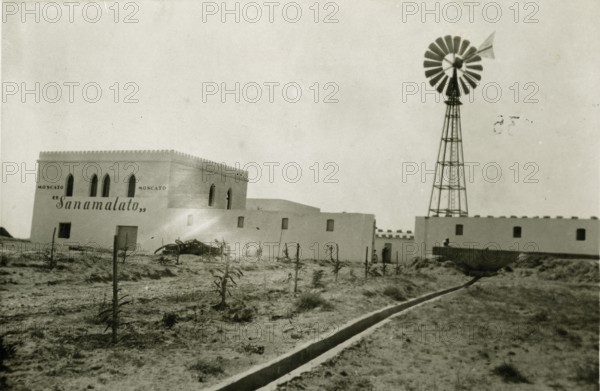 View of the Sanamalato farm in Tripolitania, with a wind turbine system for lifting.