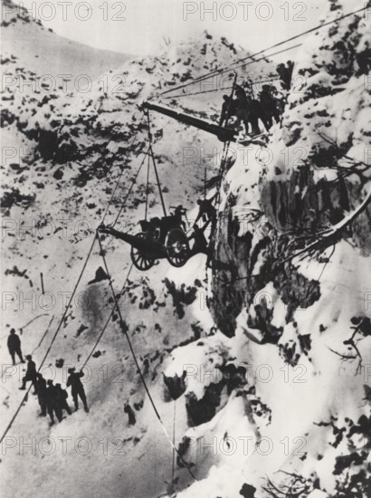Carrying a cannon to a summit.