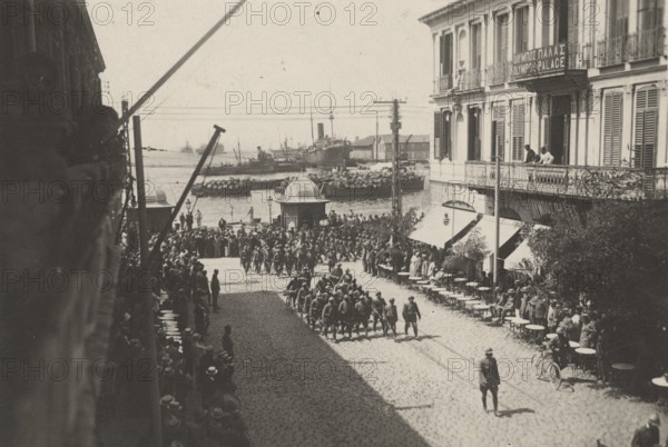 The 64th Infantry Regiment parades through the streets of Thessaloniki.