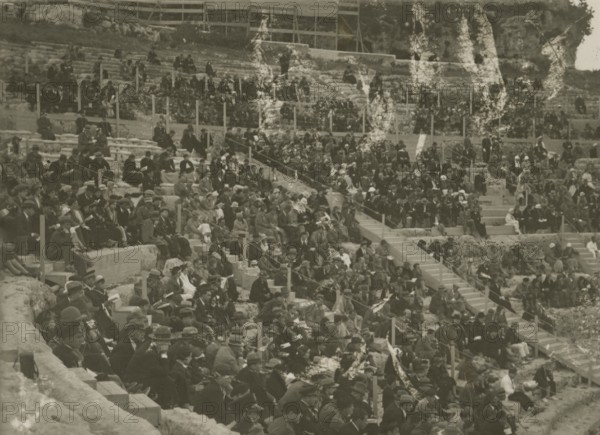 The Greek Theatre of Syracuse packed with people.